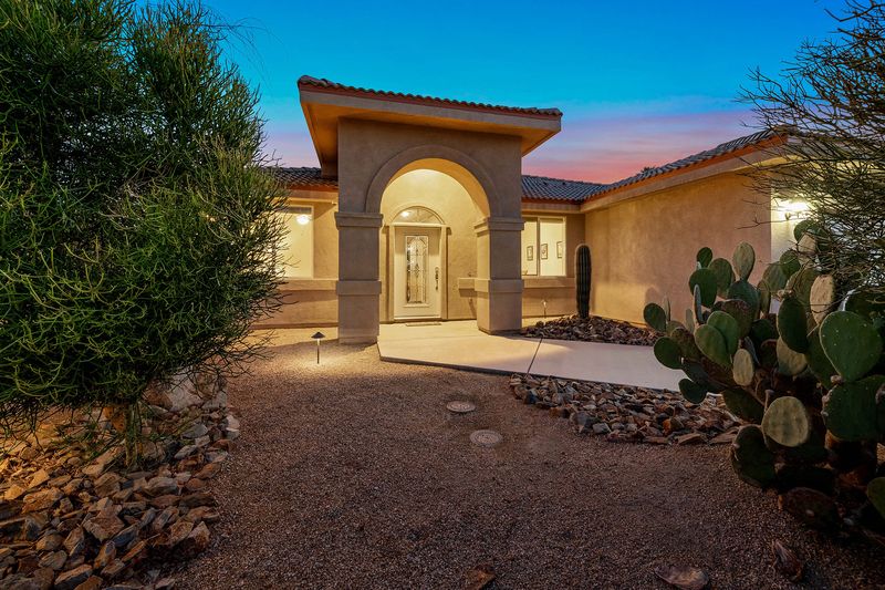 Front exterior at twilight of Palms Place in Indian Palms Country Club, Indio