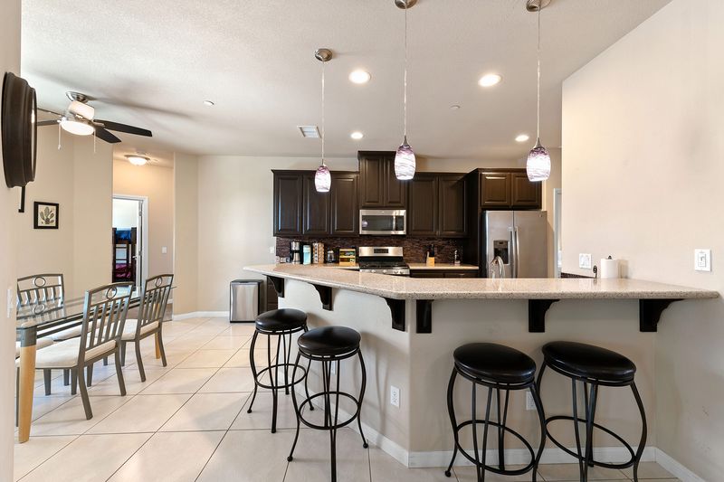 Kitchen island with bar seating at Palms Place Indio