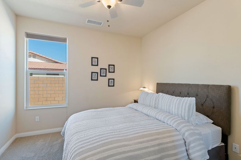 Queen bedroom with premium bedding at Palms Place Indio